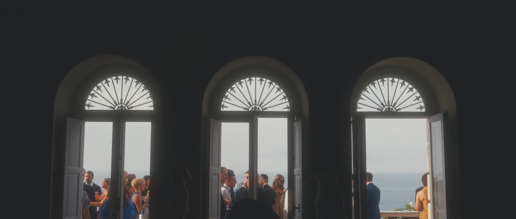 Guests framed by the villa windows