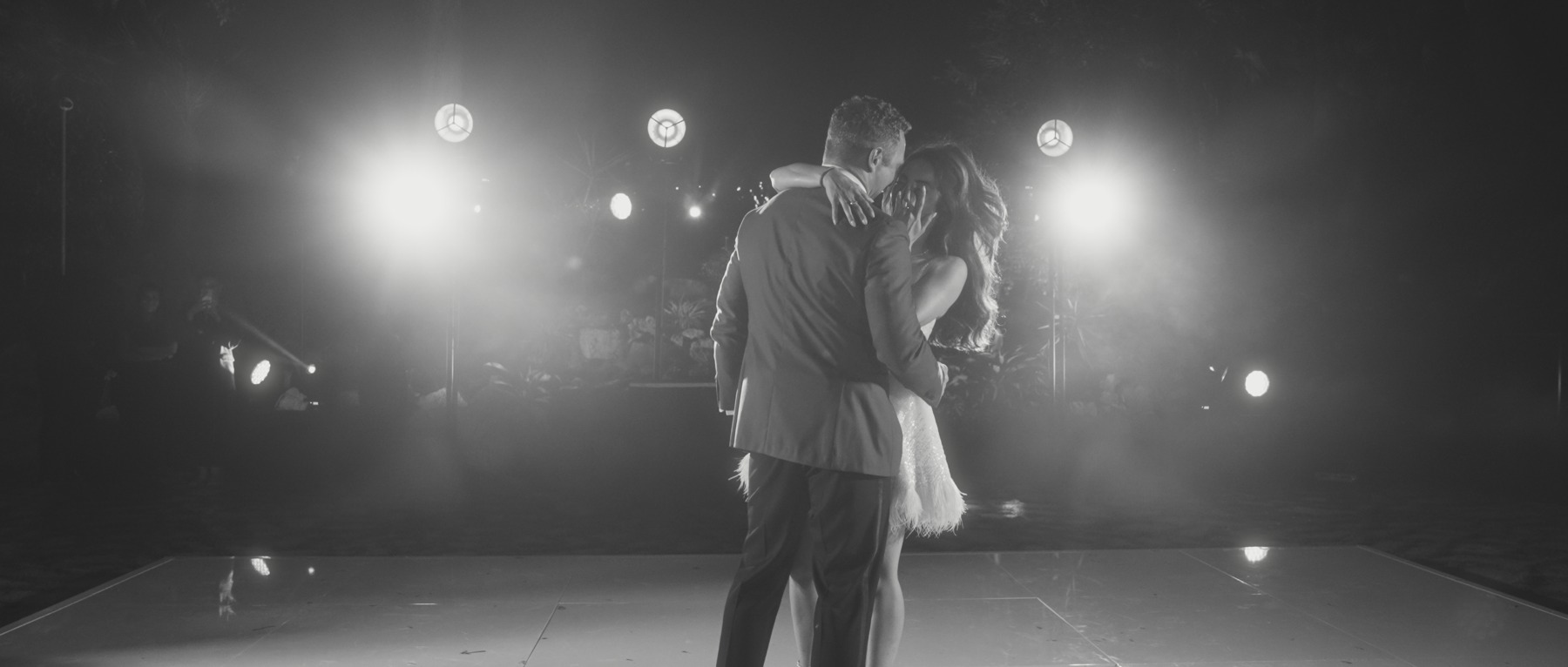 Morgan and Patrick dancing together in black and white
